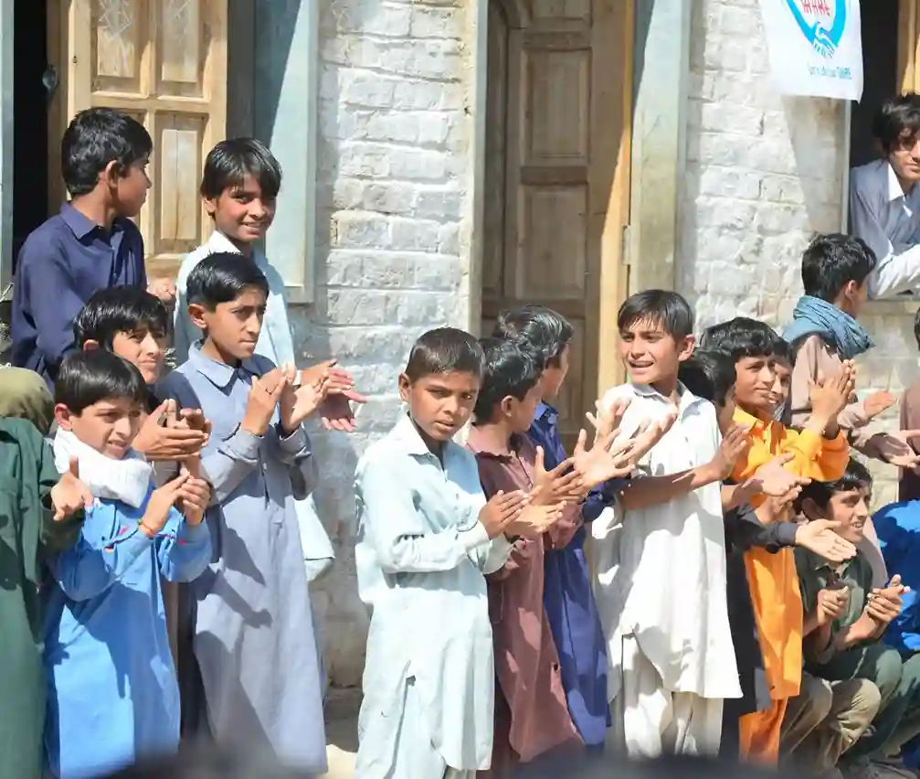 Volunteers sharing meals with children